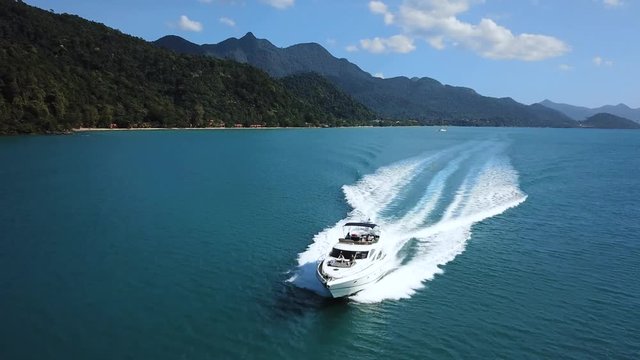 luxury boat aerial view, luxurious yacht moving fast in blue sea