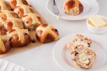 Homemade Easy traditional Hot Cross Buns, perfect for Easter. Toast and spread with butter.