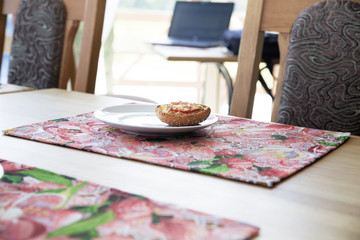 sandwich on a white plate on a table