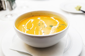 pumpkin soup in a white plate