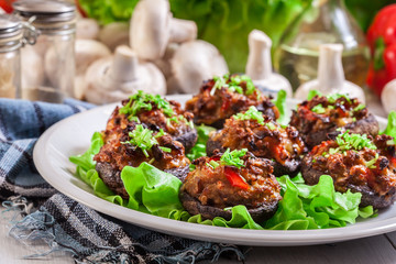 Baked champignon caps stuffed with minced meat