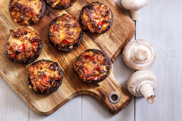 Baked champignon caps stuffed with minced meat