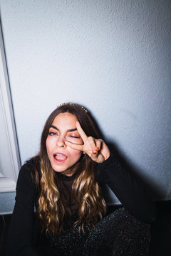 Expressive woman at wall