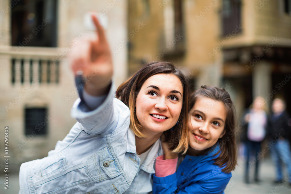 Poster young mother and daughter paying attention to sight