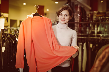Woman shows a stylish jacket