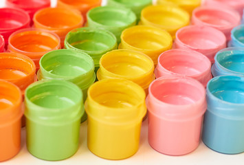 Many cans of bright colors