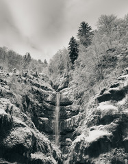 Waterfall on snowy mountain