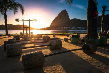 Raamstickers Concrete Weights at the Outdoor Gym in Flamengo Park in Rio de Janeiro During Sunrise with the Sugarloaf Mountain in the Horizon © Donatas Dabravolskas