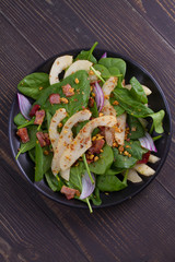 Spinach pear and bacon salad with walnuts