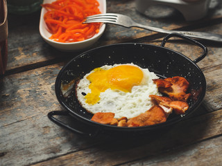 fried eggs with fried mushrooms and carrot salad