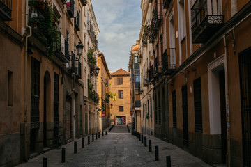 Fototapeta na wymiar Road Between Buildings in Spain