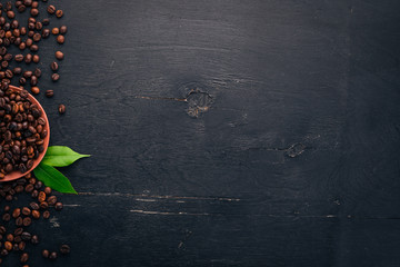 Coffee beans. On a wooden background. Top view. Copy space.