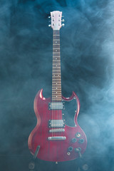Obraz na płótnie Canvas electric guitar in dense smoke