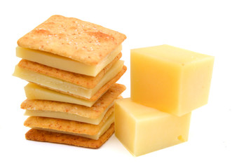 Delicious crackers with cheese on white background