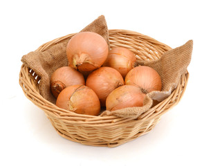fresh onions vegetables isolated in basket on white background