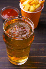 Beer and fries with tomato sauce