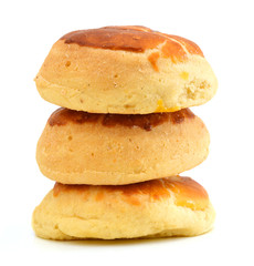 Three soft white bread rolls.