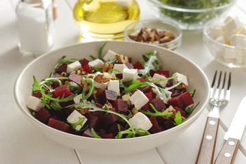 Bowl of beetroot feta salad for healthy diet on whit wooden table. - 187801611