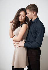 romantic couple posing on white background, love concept