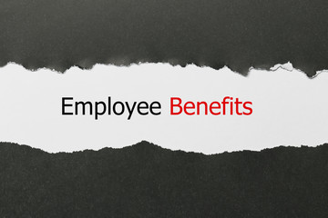 The text Employee Benefits appearing behind torn paper