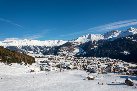 View on the village Fiss in the ski resort Serfaus Fiss Ladis in Austria with snowy mountains