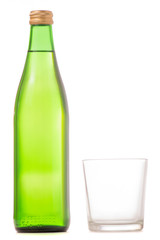 Glass bottle of soda water and glass