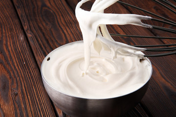 close up of a white whipped or sour cream in bowl