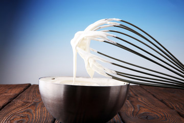 close up of a white whipped or sour cream in bowl