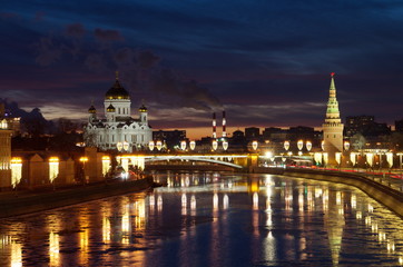 Fototapeta na wymiar Evening view of the Moscow-river, Cathedral of Christ the Savior and the Big Stone bridge, Moscow, Russia