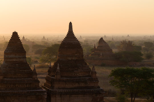 Scenic view of Bagan Plain with many pagodas and temples in Bagan, Myanmar (Burma) at sunrise.