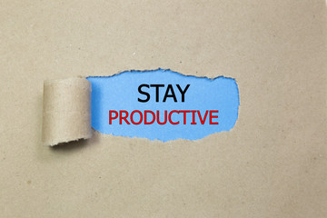 Stay Productive Motivation quote written behind a torn paper