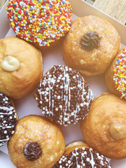 Fresh donuts on bakery display for Hanukkah celebration. 