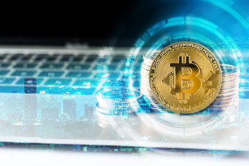 Cryptocurrency golden bitcoin and dollars money on laptop computer, digital currency concept