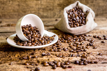 Coffee. Coffee beans. Coffee cup full of coffee beans.