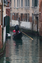 Fototapeta na wymiar Gondola ride in Venice canal , Italy 