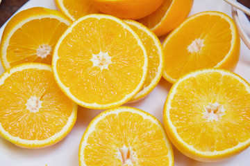 sliced ​​orange rings on a white background
