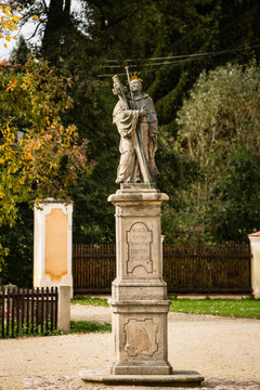 Old statue in city centre park
