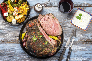 Barbecue marinated lamb roast with vegetable and feta as close-up in a bowl . © HLPhoto