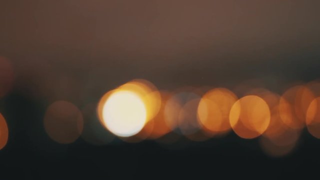 Blurred defocused abstract bokeh lights background, retro vintage toned footage