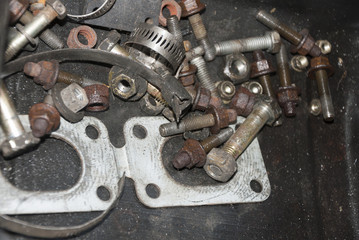 Rusty nuts and bolts of vehicle in mechanical workshop