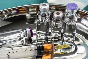  Some Vials And Syringe On Operating Table