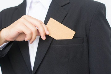 Part of body of business man who takes out business card from the pocket of business suit