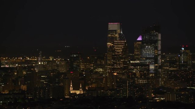 Philadelphia, Pennsylvania circa-2017, Night aerial view of downtown Philadelphia buildings.  Shot with Cineflex and RED Epic-W Helium. 