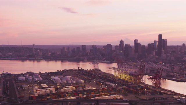 Seattle, Washington circa-2017, Aerial view of port with downtown Seattle in distance at sunrise.  Shot with Cineflex and RED Epic-W Helium. 