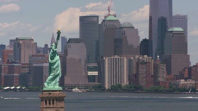 New York City, New York circa-2017, Aerial view of Statue of Liberty and Manhattan.  Shot with Cineflex and RED Epic-W Helium. 