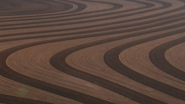 Aerial view of plowed patterns in field