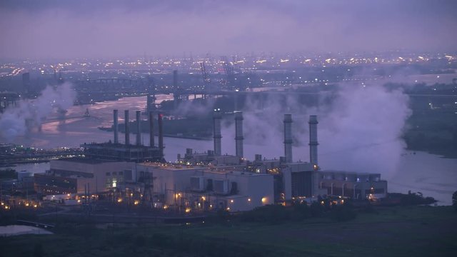 New Jersey circa-2017, Flying by industrial area with power plant in early morning.   Shot with Cineflex and RED Epic-W Helium. 