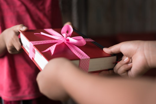 giving a book as a present. give a book day