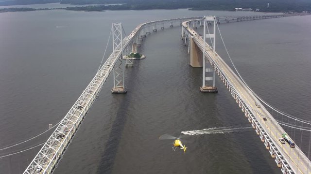 Aerial shot of helicopter flying by the Chesapeake Bay Bridge.  Shot with Cineflex and RED Epic-W Helium. 