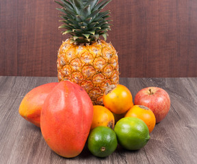 set of fruits on wooden background